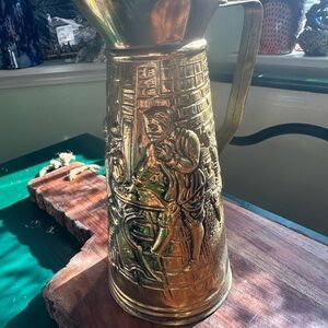 Embossed Brass Pitcher with Figural Detailing